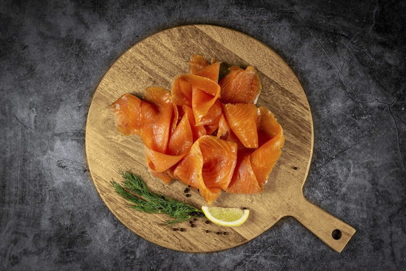 200g Smoked Salmon on serving board with dill and lemon