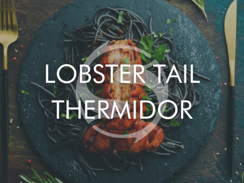 Lobster Tail Thermidor with knife and fork on a plate