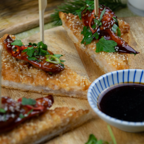 Prawn Toast with Soy Glazed Lobster and Soy Sauce dip on a sharing platter