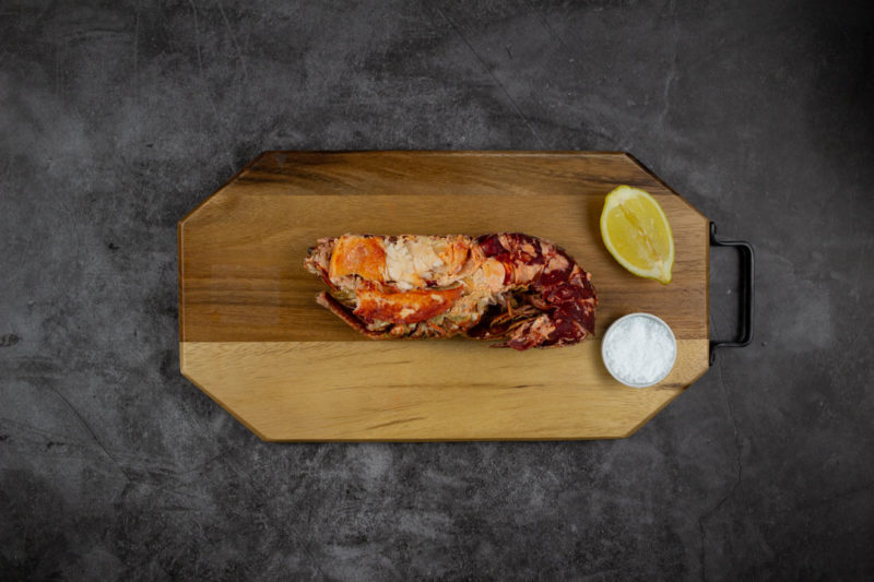 half lobster on a board